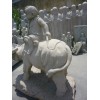 Stone cow boy Statue