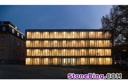 Glass panes with stone facsimiles form the façade of Essen’s Folkwang-Library in Germany