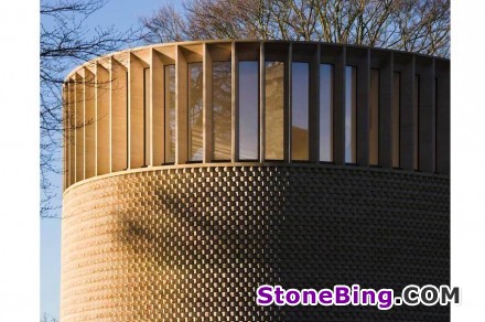 The façade of England‘s Ripon College Chapel is clad in a natural stone weave