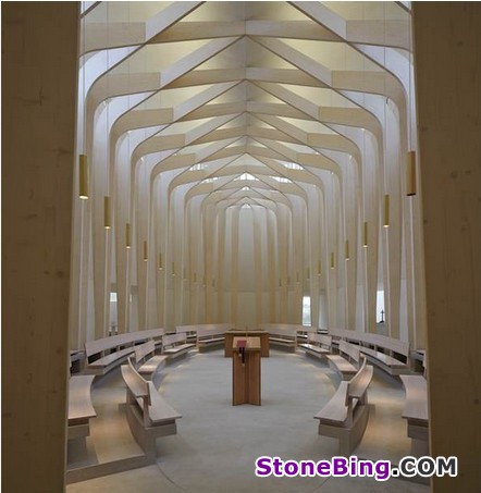 The façade of England‘s Ripon College Chapel is clad in a natural stone weave